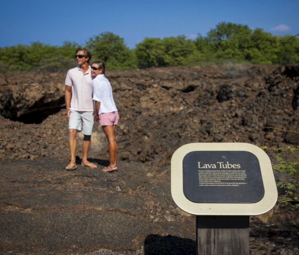 A couple stands near a 